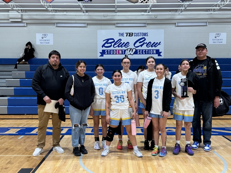picture of santee girls basketball team in white jerseys taking a group picture for 2nd place in the tournament 