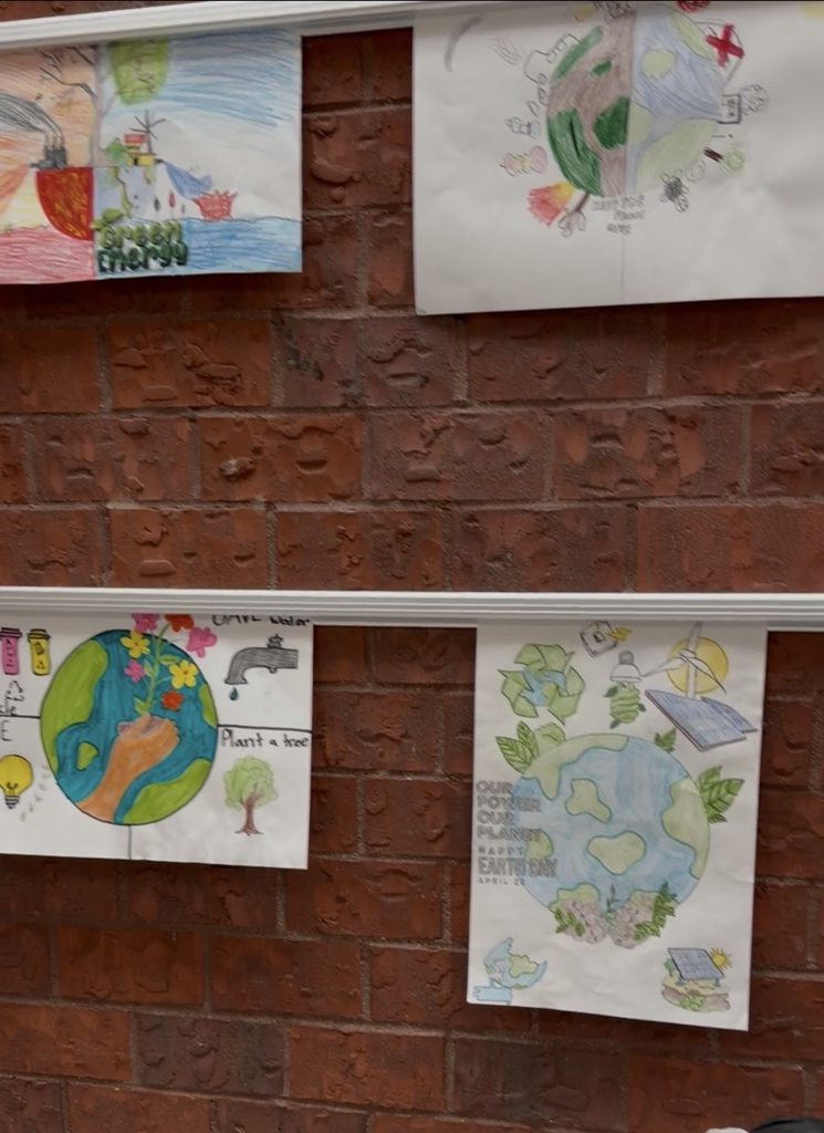 pictures drawn by students of the earth with hands taking care of the earth 