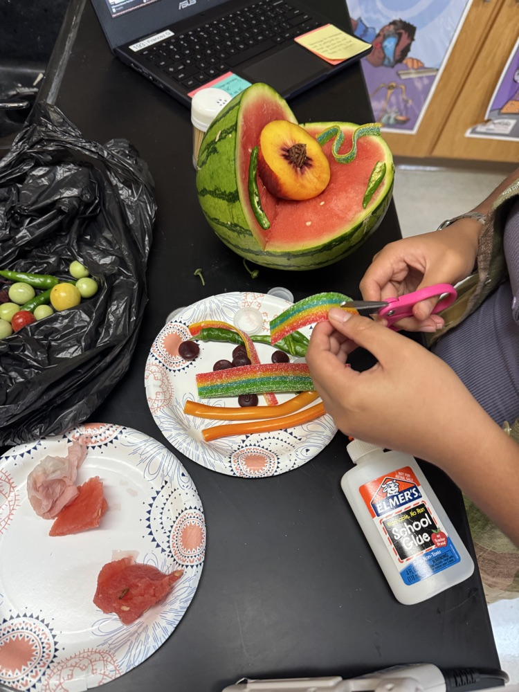 Photo of a student hands creating a science project