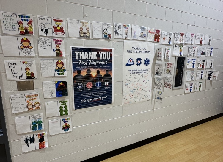 photo of a white wall with several home made thank you cards on white paper for our first responders 