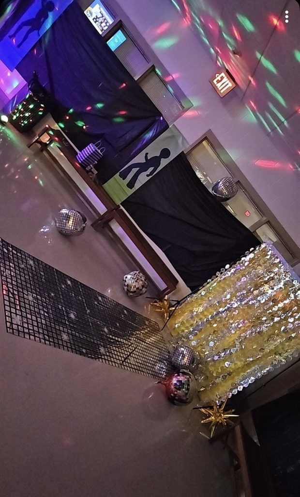 school commons area decorated with 70s decorations 