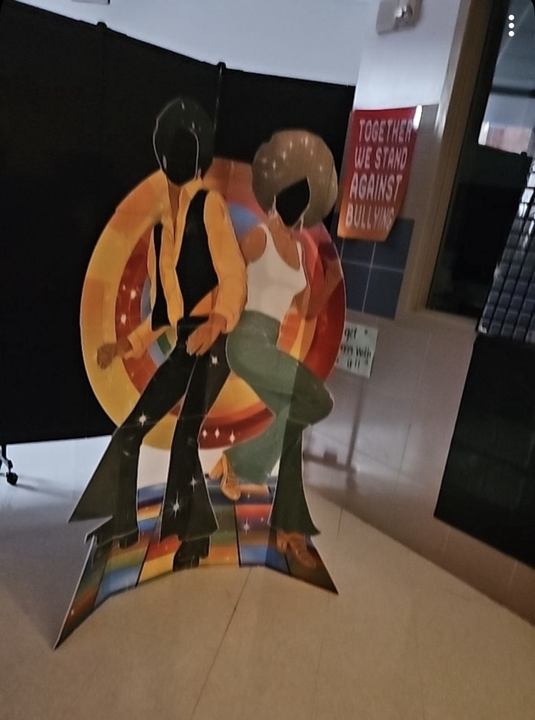 school commons area decorated with 70s decorations 
