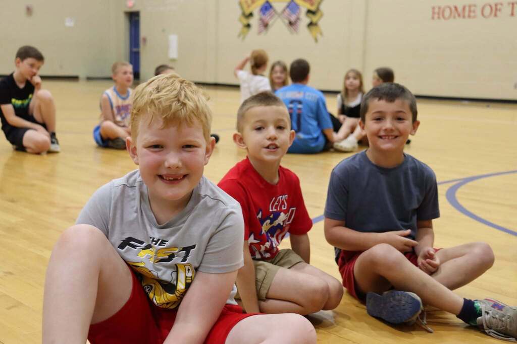 3 students smiling