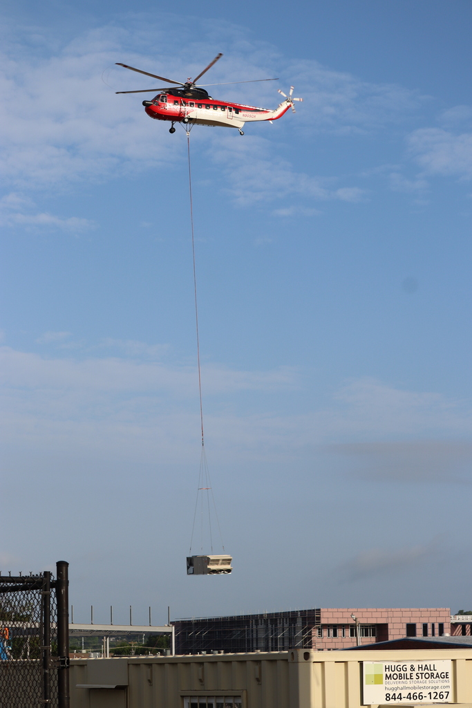 Helicopter hauling A/C unit