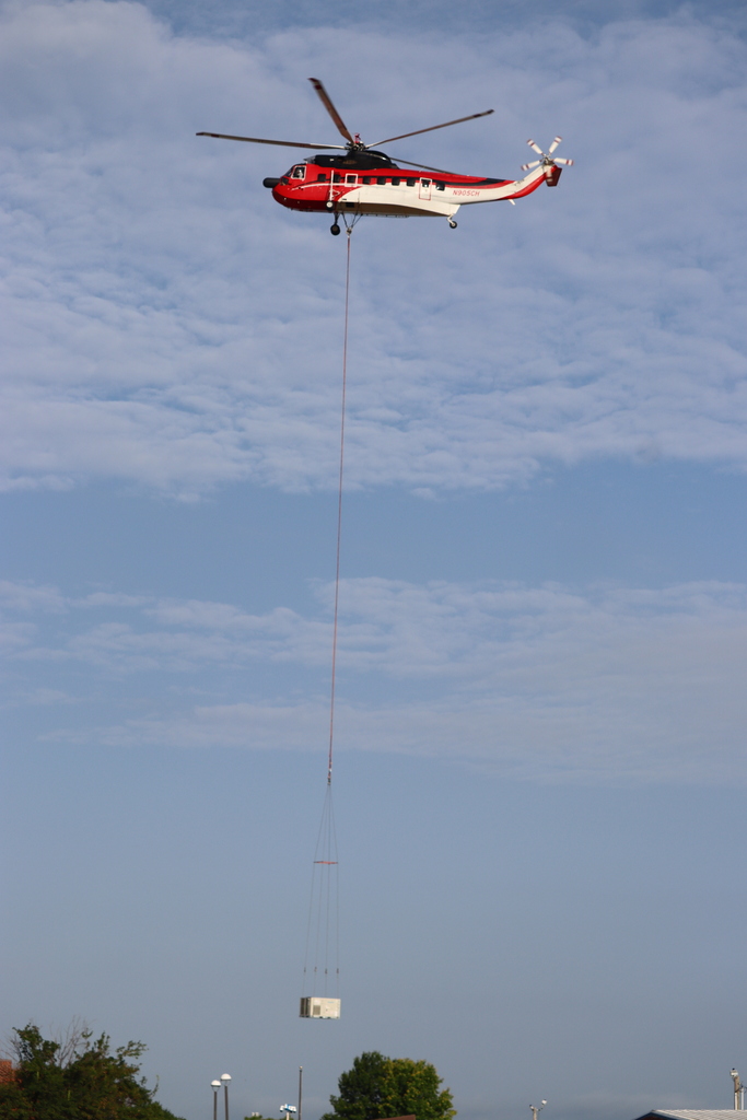 Helicopter hauling A/C unit