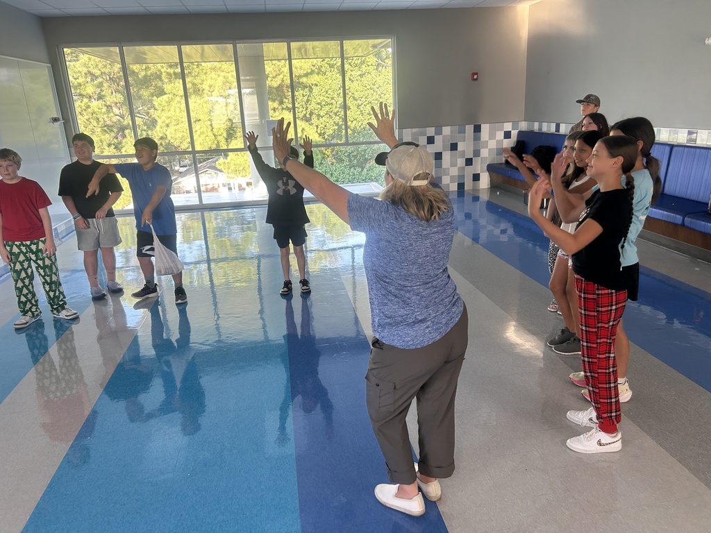 students dancing in a circle