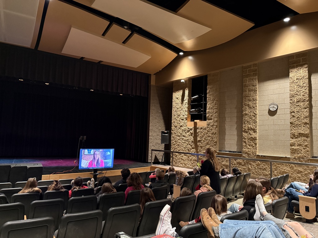 Miss Priest leads the discussion for students with Julie Murney