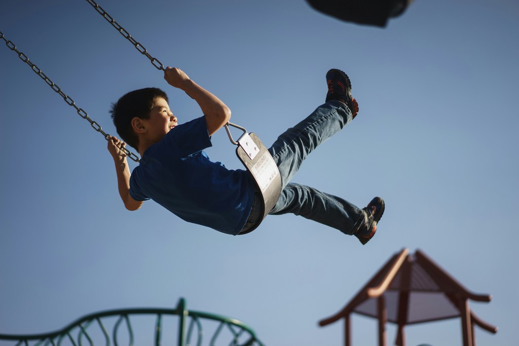 kid on swing