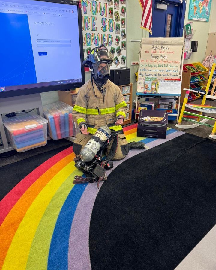 image of a fireman standing on a rainbow carpet