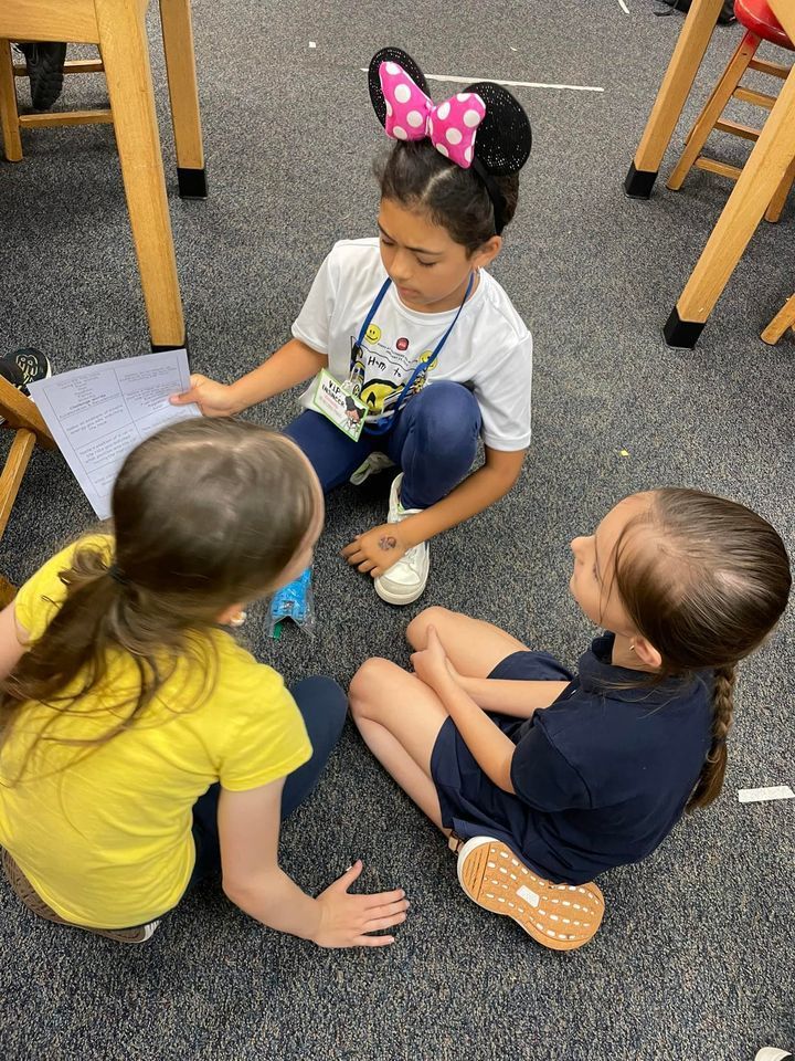 image of elementary aged girls sitting in a circle