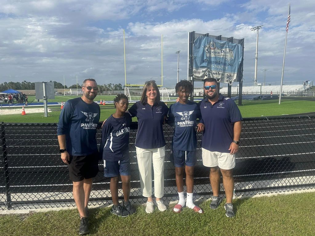 Participants and coaches smiling