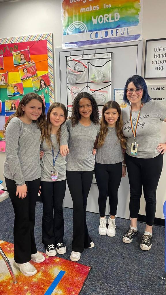 Students wearing grey matching outfits