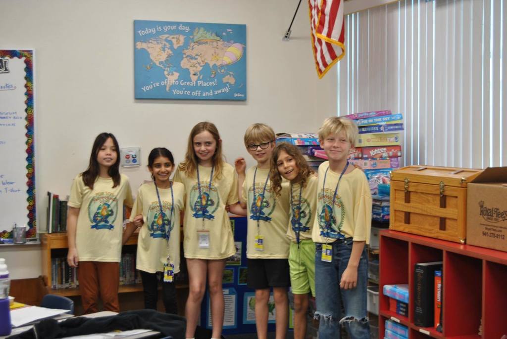 Students wearing yellow matching outfits