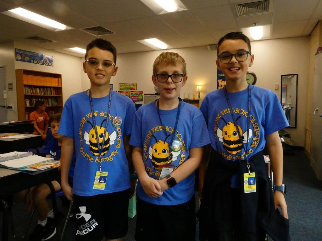 Students wearing blue matching outfits