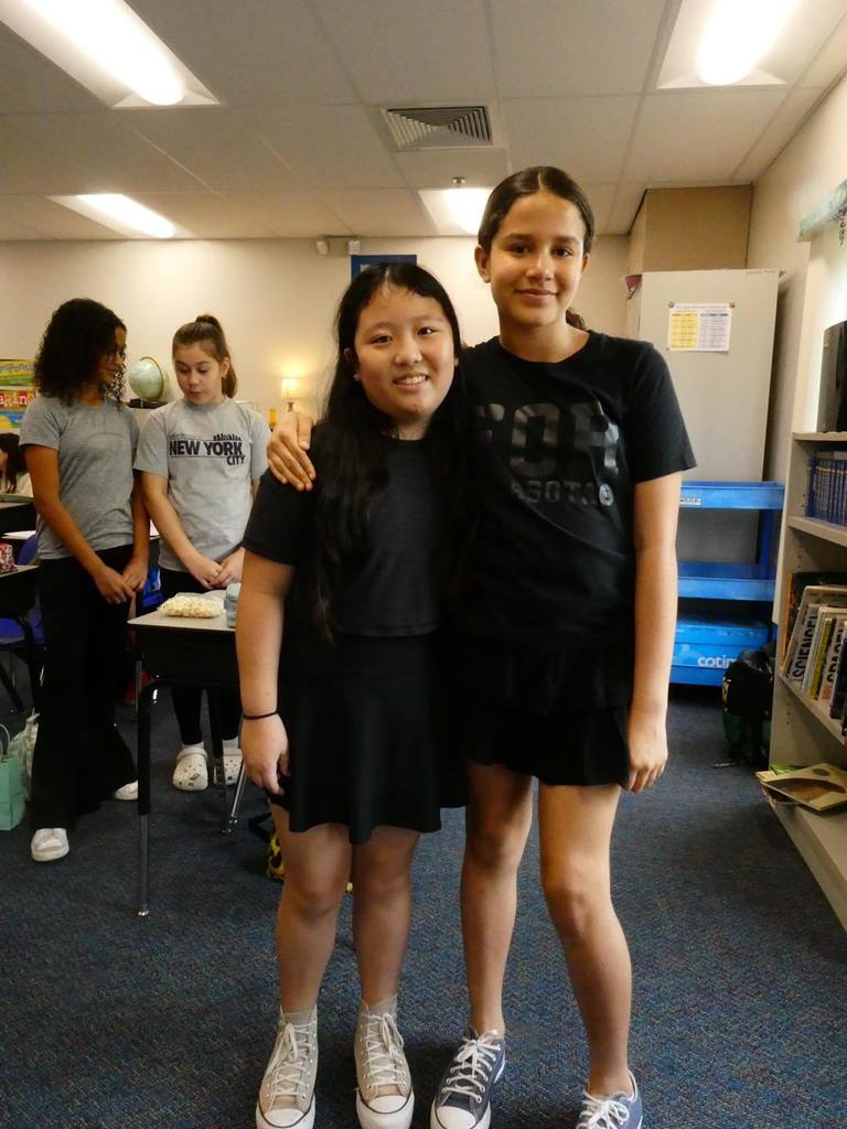 Students wearing black matching outfits