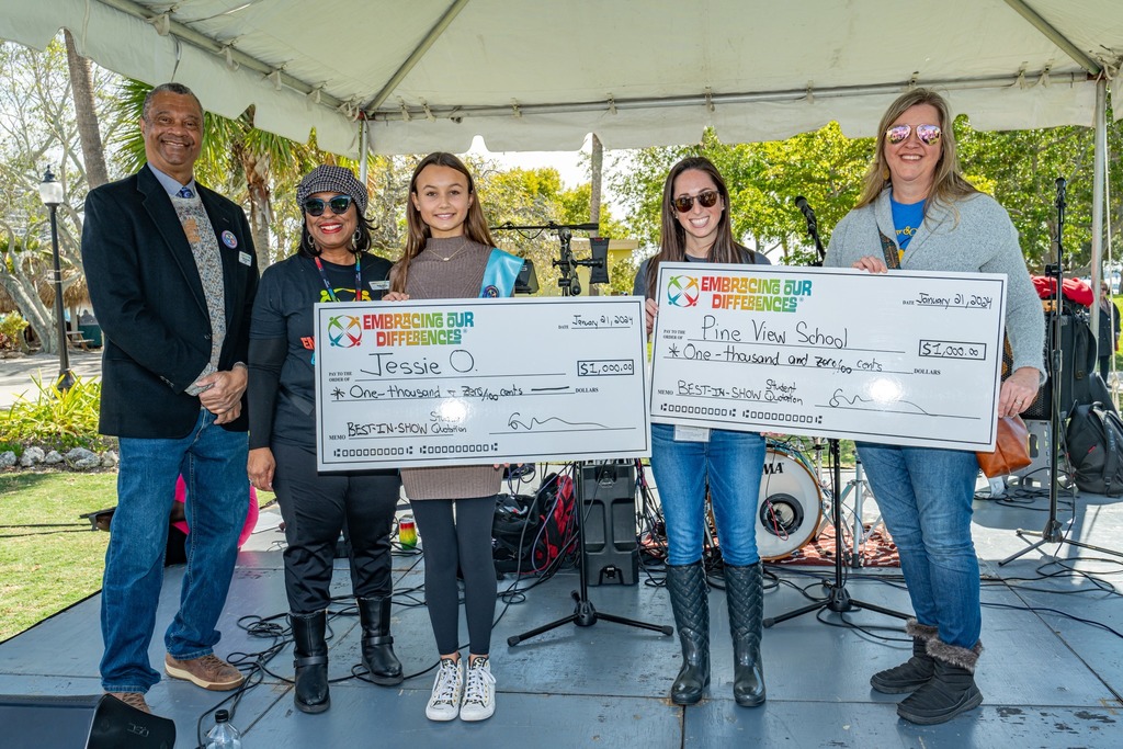 Students holding prize check