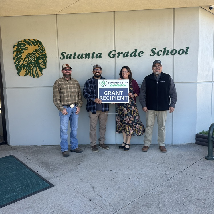 picture of 4 people with a Southern Star sign