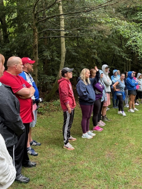 Listening to directions for a team-building challenge.