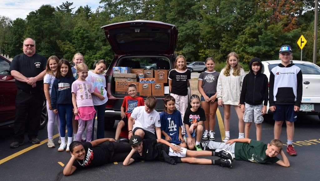 Our learners posing with the donations.