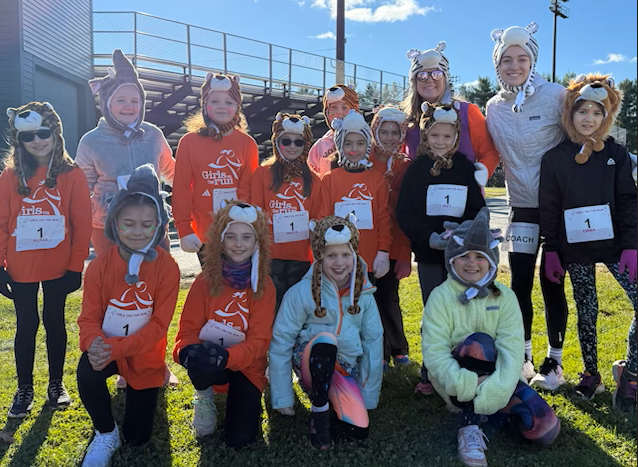 The girls posing with their animal hats!