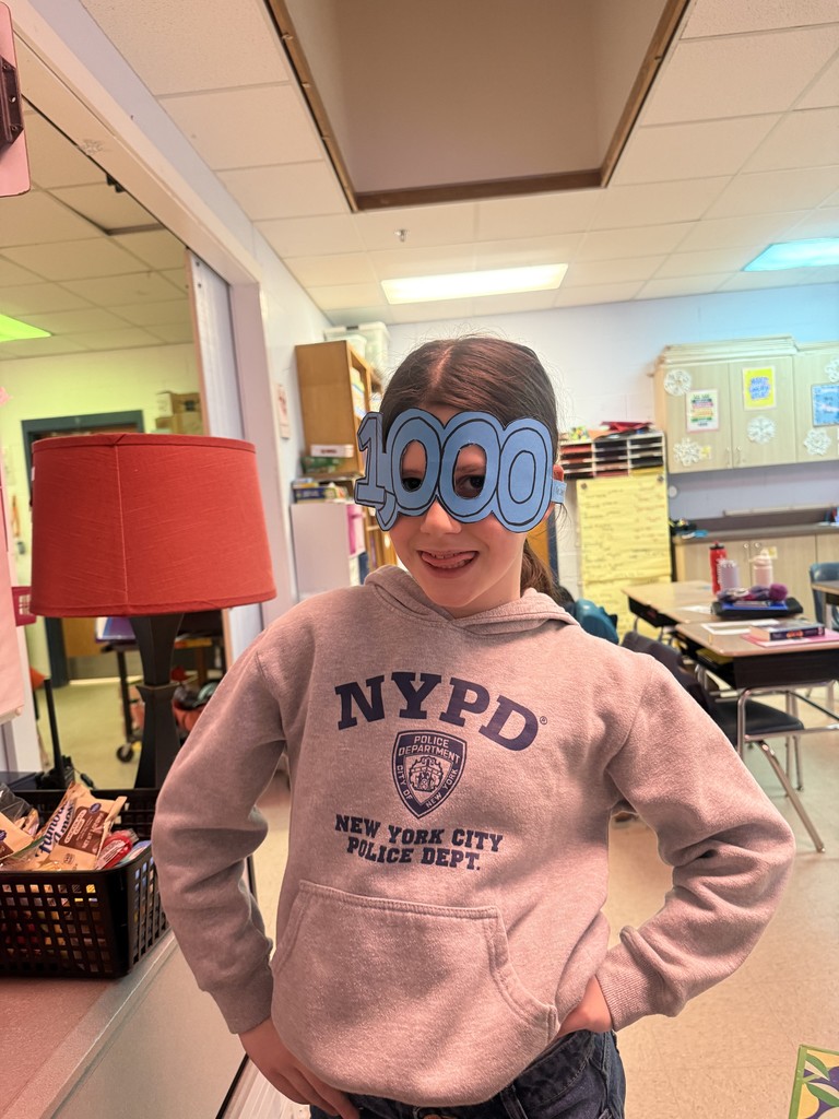 A student posing with their 1,000th day of school glasses!