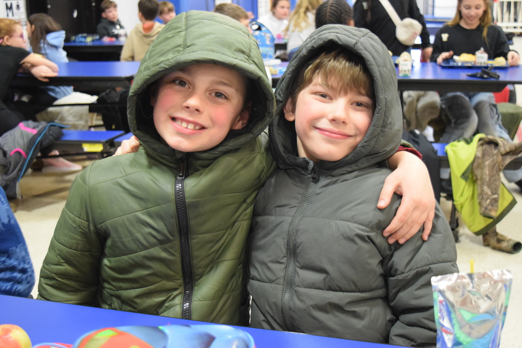 Two students matching in their coats!