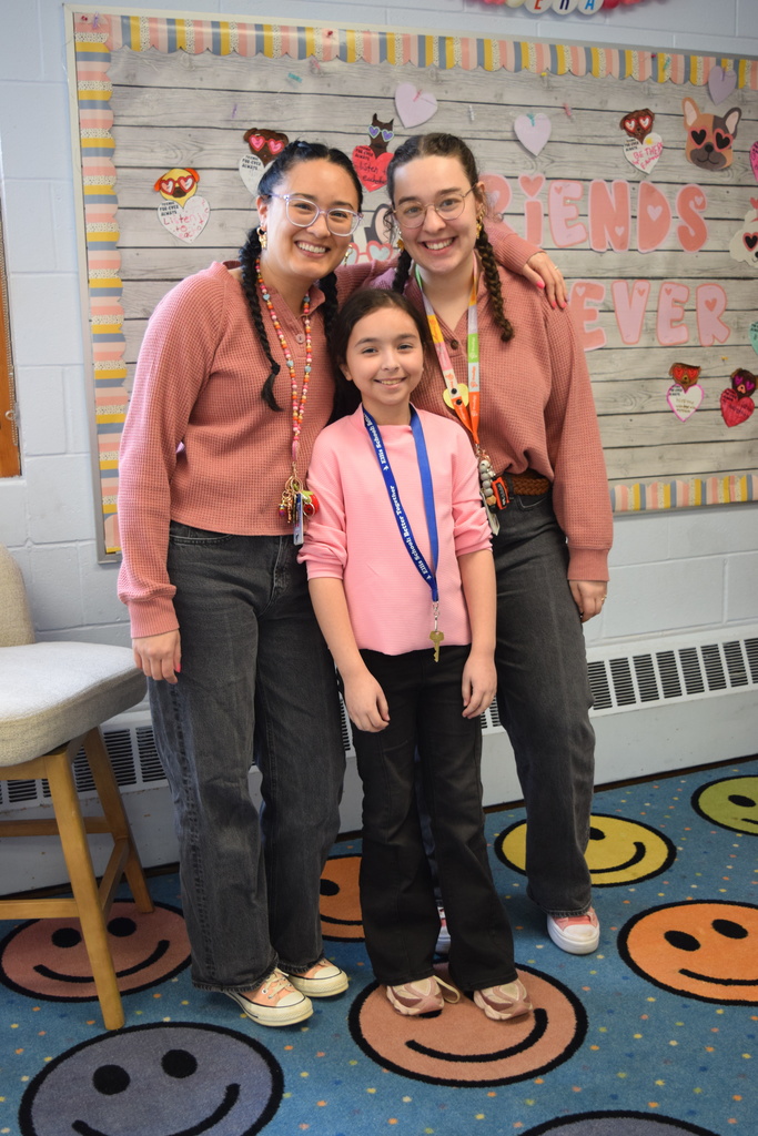 A student twinning with her teachers.