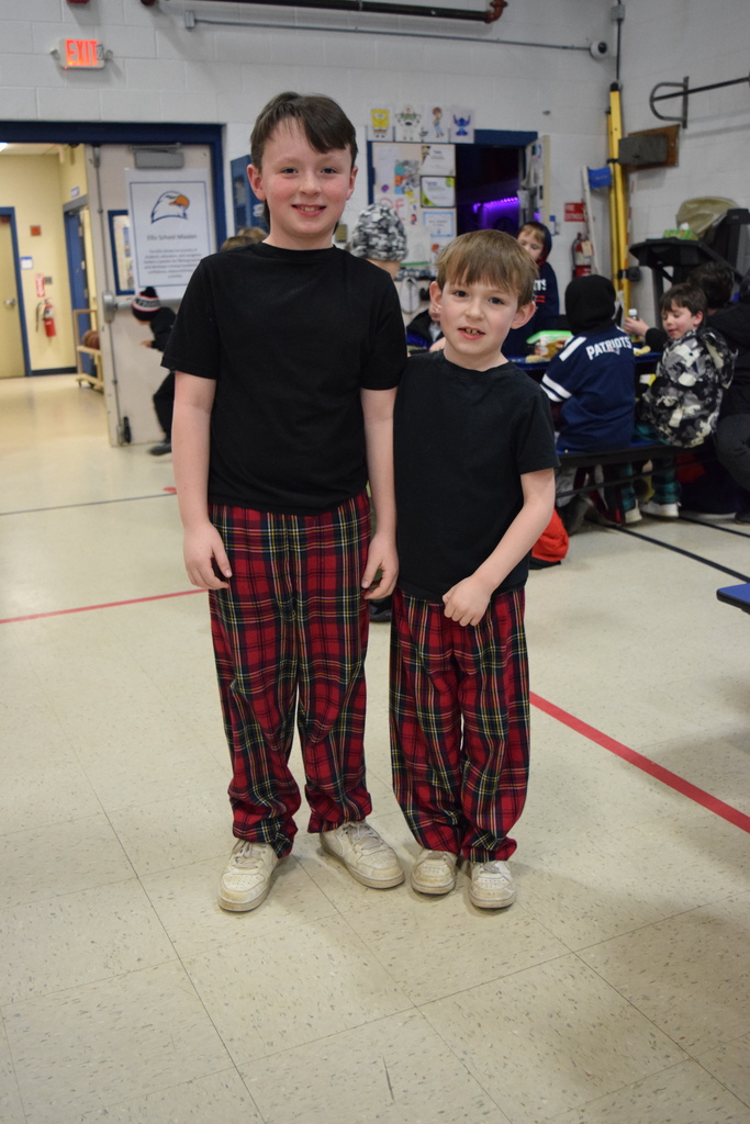 Two brothers twinning in plaid pants!