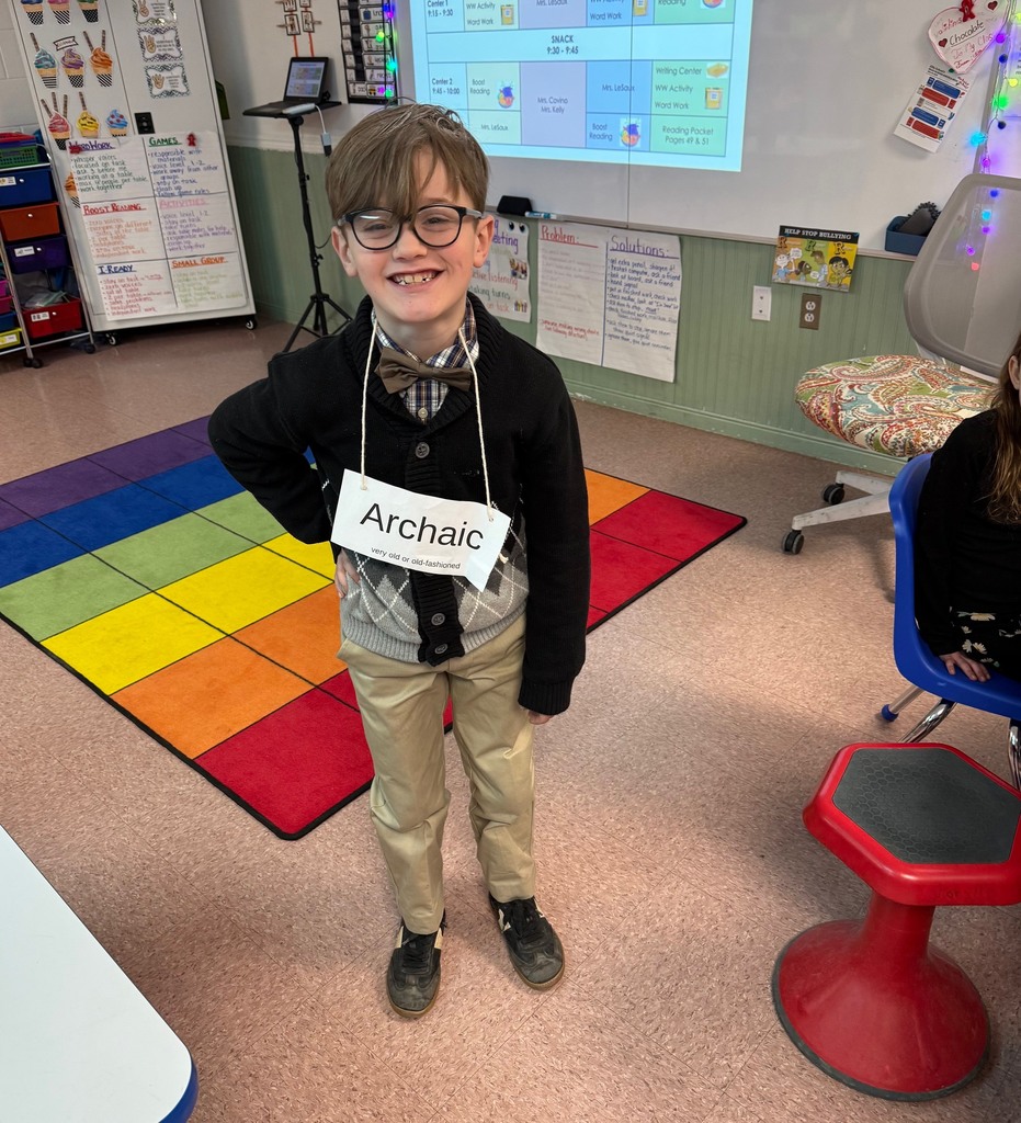 Student dressed as an elderly person with the vocabulary word "Archaic"
