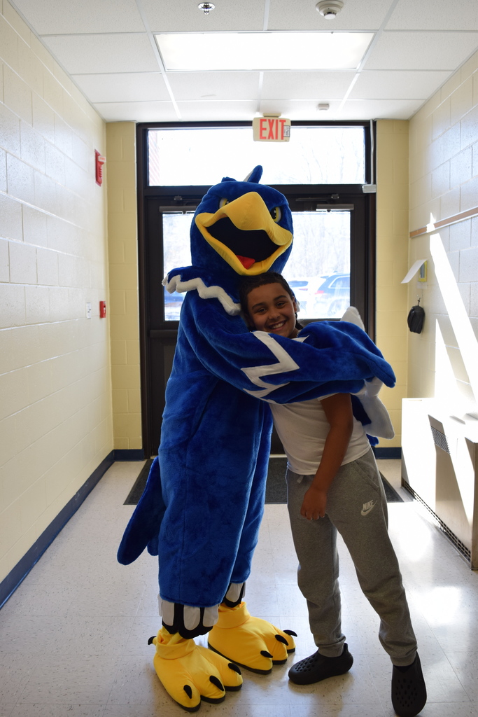 The eagle getting a hug from an Ellis student!