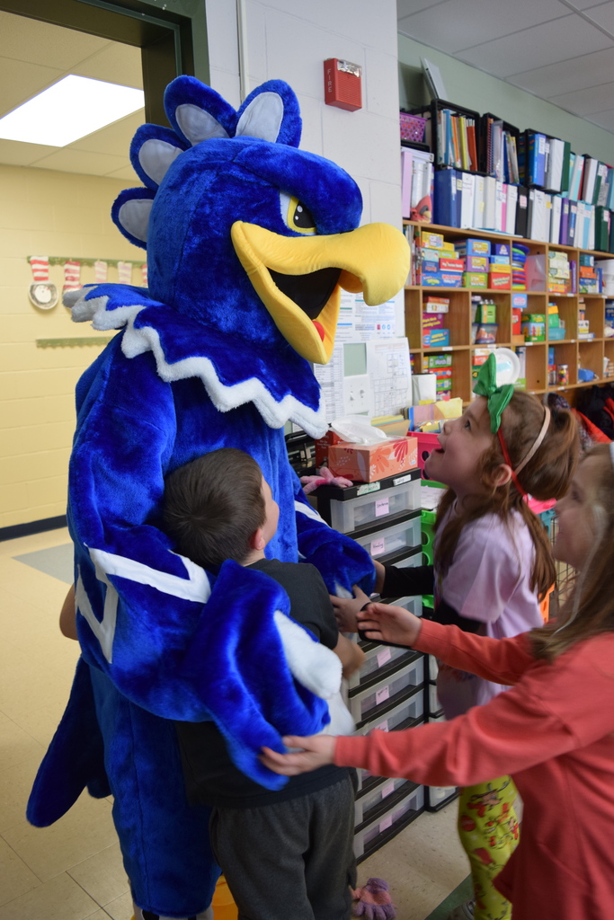 The eagle getting some hugs from a kindergarten class!