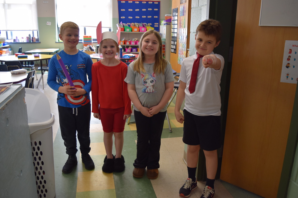 A group of students posing in their Peppa Pig, Captain America, and more!