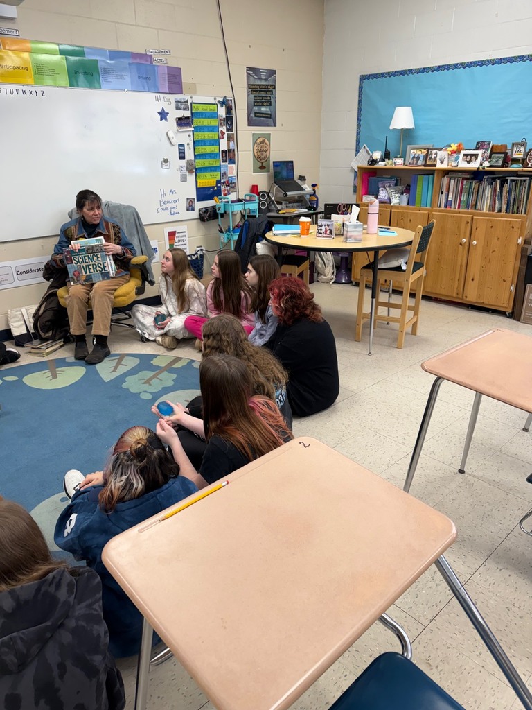 Mrs. Crowell reading to our middle schoolers