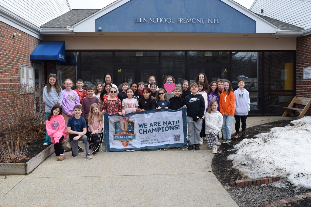 Mrs. Gauthier and Mrs. Gibb's classes posing with their banner!