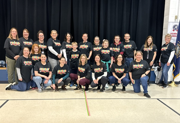 Ellis Staff posing for a picture in their Autism Awareness t-shirts