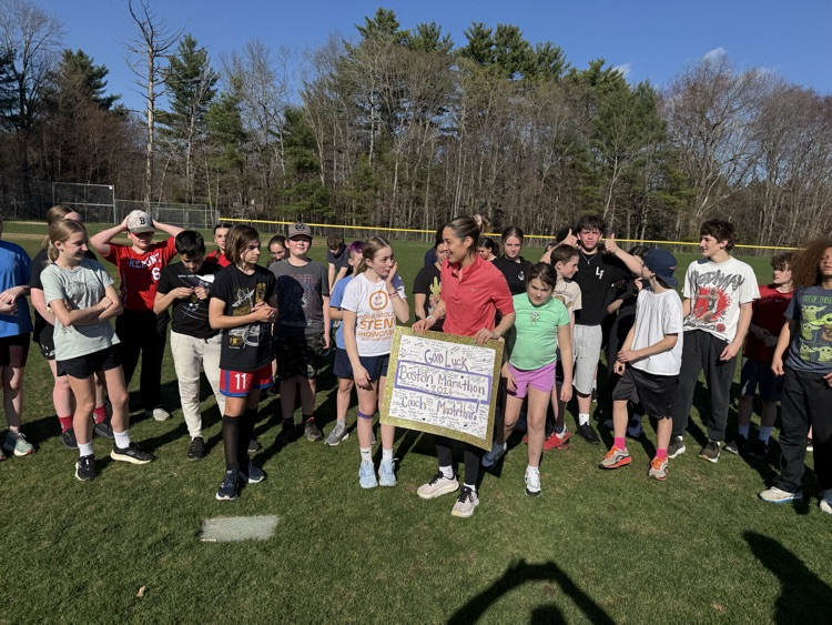 The track team posing with Mrs. MacArthur!