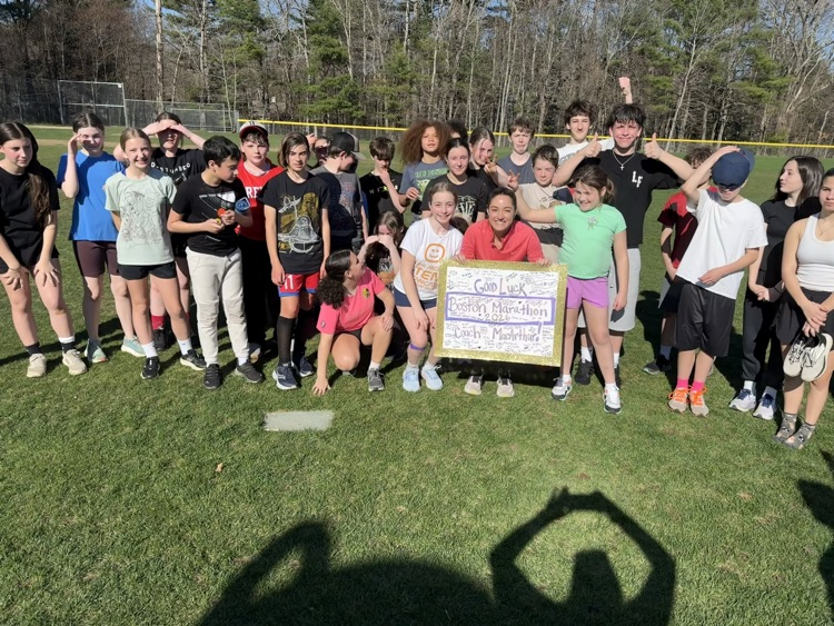 The track team posing with Mrs. MacArthur!