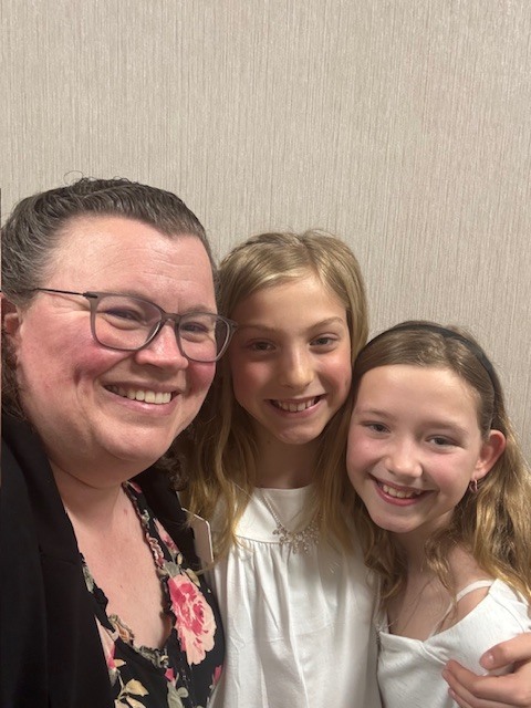 Mrs. Bolduc posing with our two students.