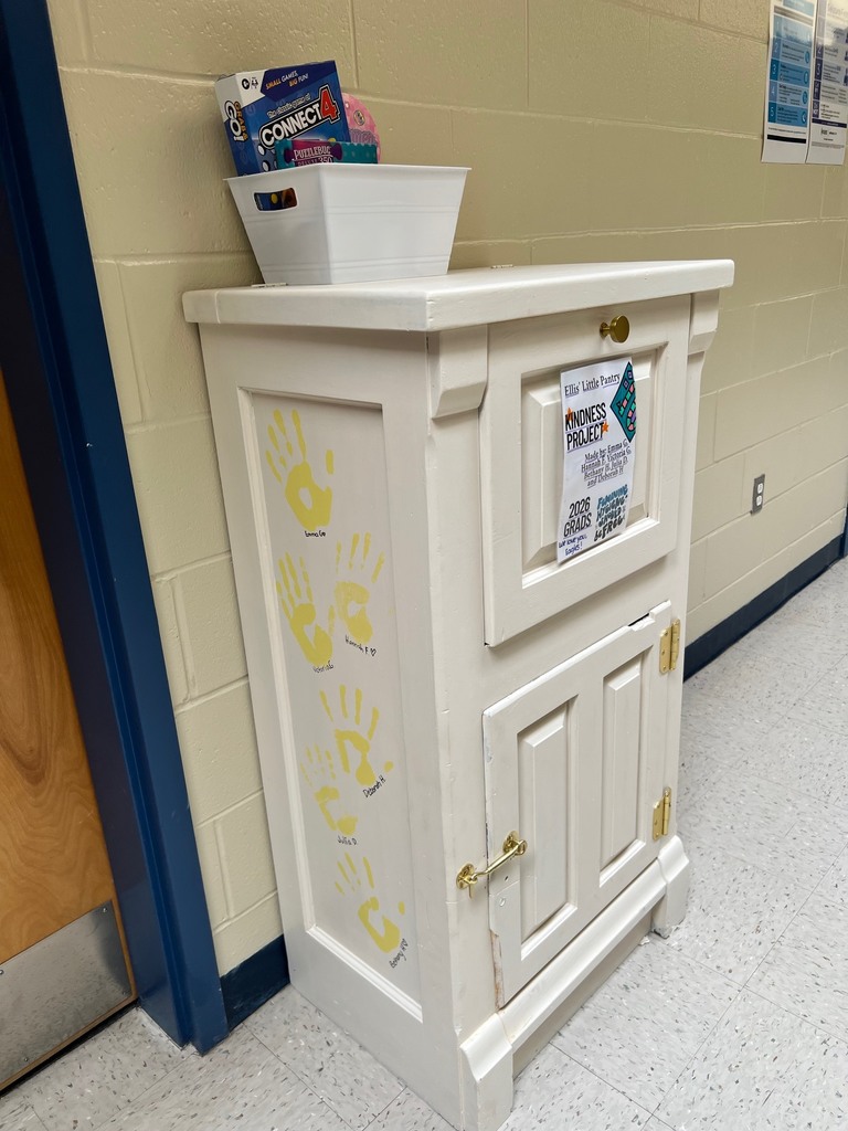 The side of the pantry, which has their handprints on it.