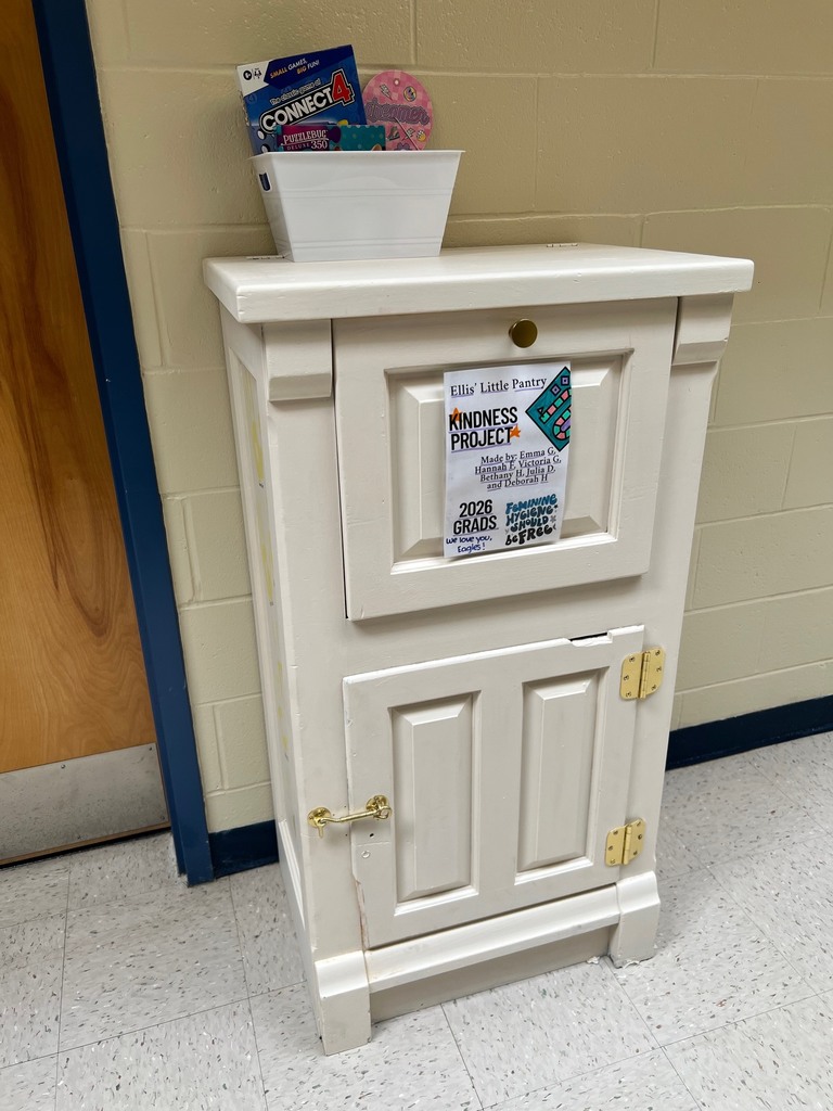 Ellis' Little Pantry with a sign that says "Kindness Project; Feminine Hygiene Should Be Free"