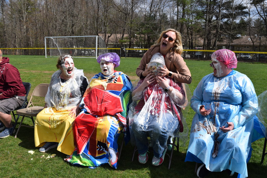 Mrs. Scott pieing Mrs. Dobson in the face