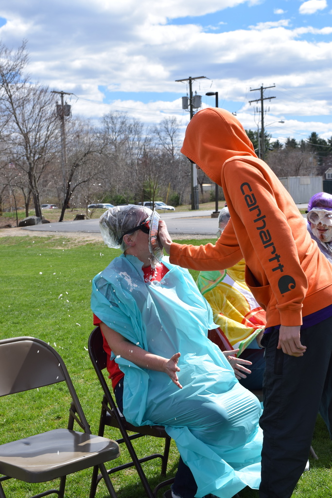 A student pieing a teacher in the face!