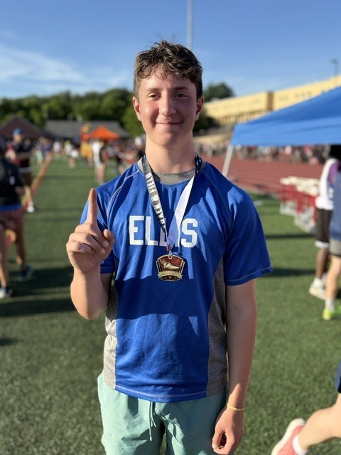 Noah posing with his gold medal.