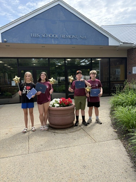 Emma, Allie, Beauden, and Colin posing with their awards