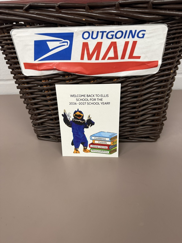 picture of postcard in front of outgoing mail