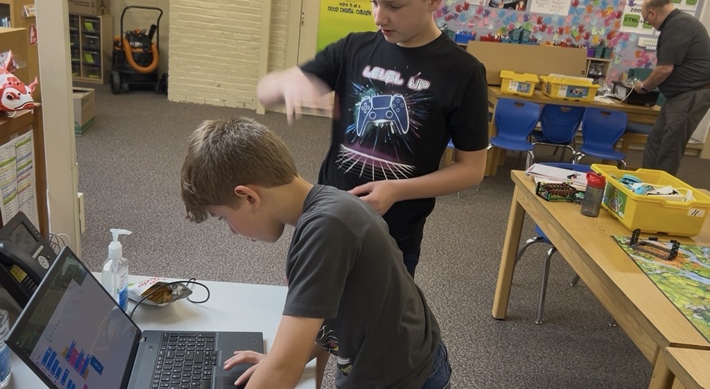 Two students practicing code