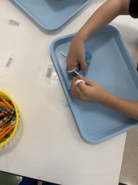 Student practicing flossing