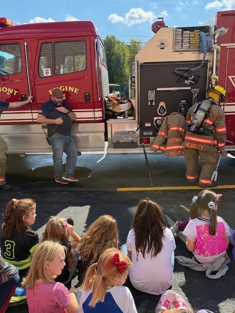 Showing students what fire fighter gear looks like