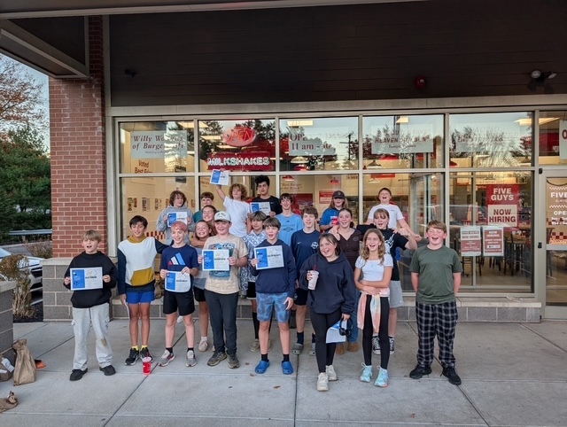 Soccer team in front of Five Guys