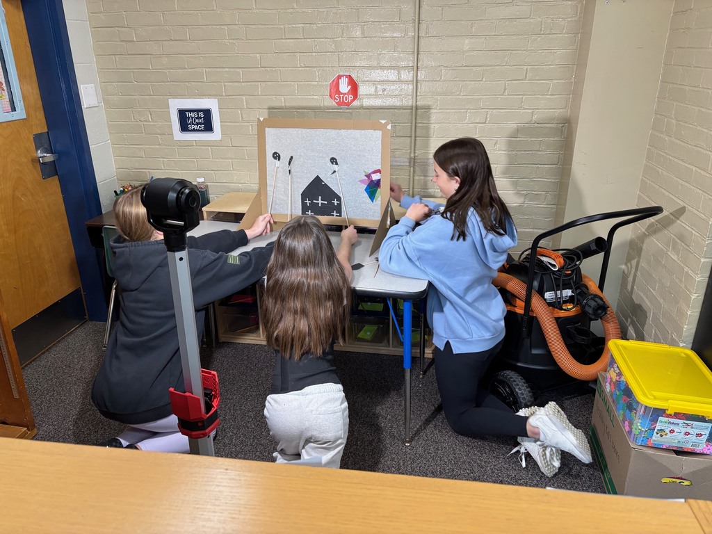 Students using shadow puppets to make their video.
